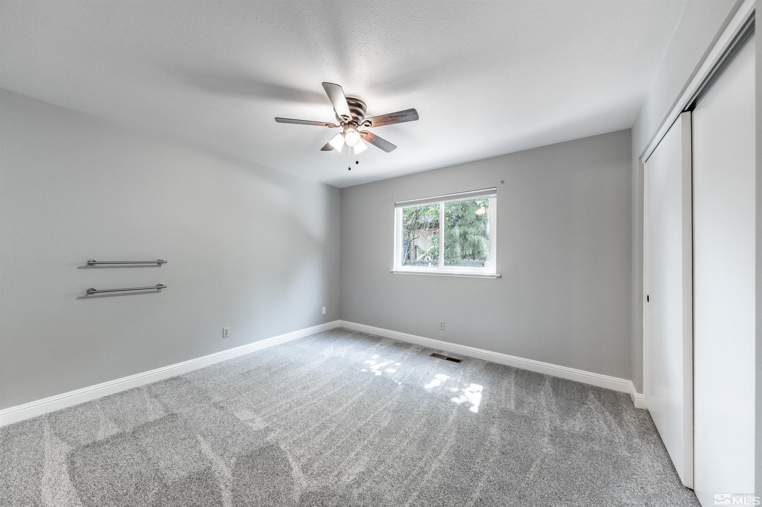 4795 Warren Way Reno, NV 89509 - Photo 25 of 40 a view of an empty room with a window