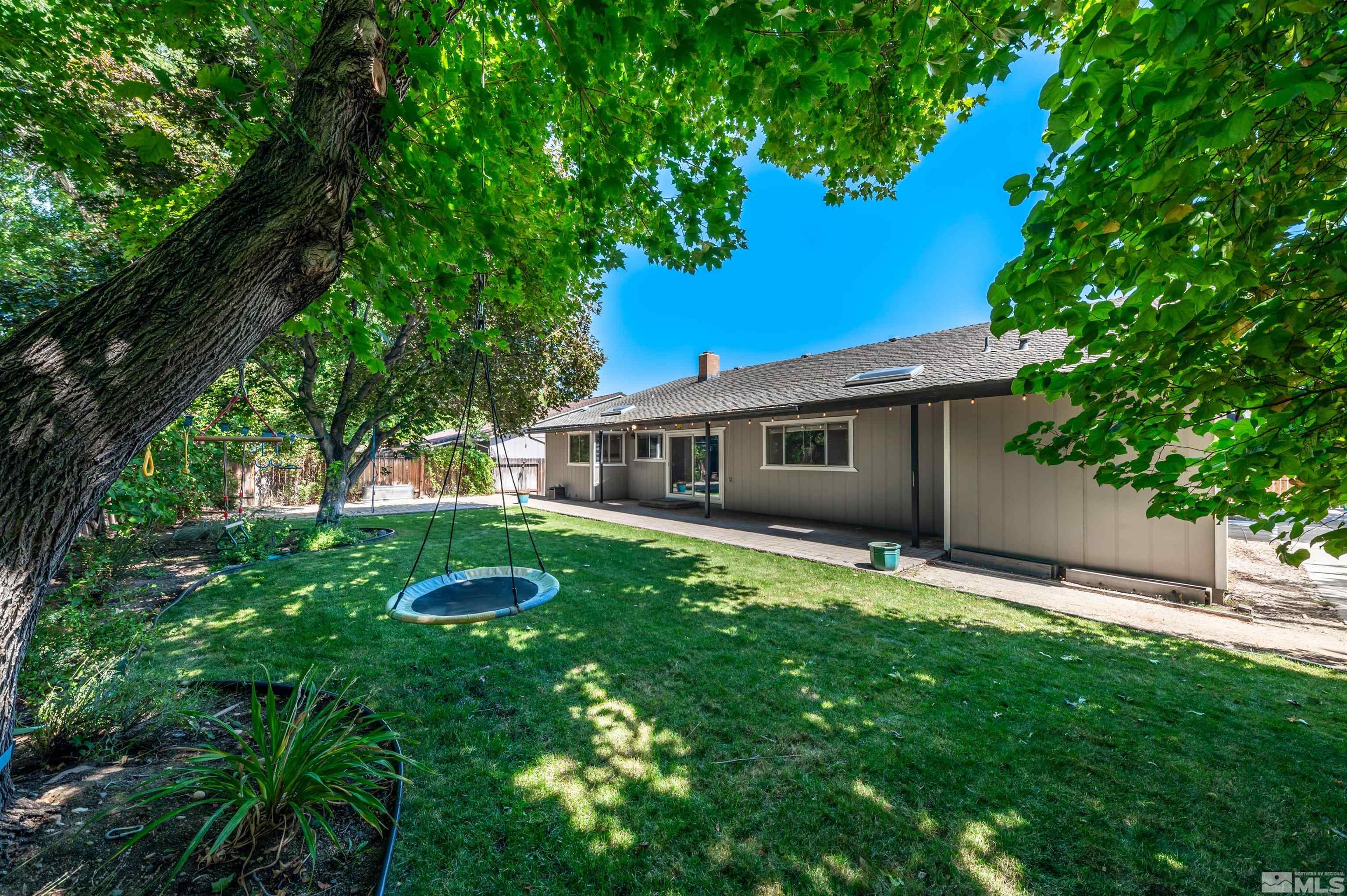 4795 Warren Way Reno, NV 89509 - Photo 32 of 40 a front view of a house with garden