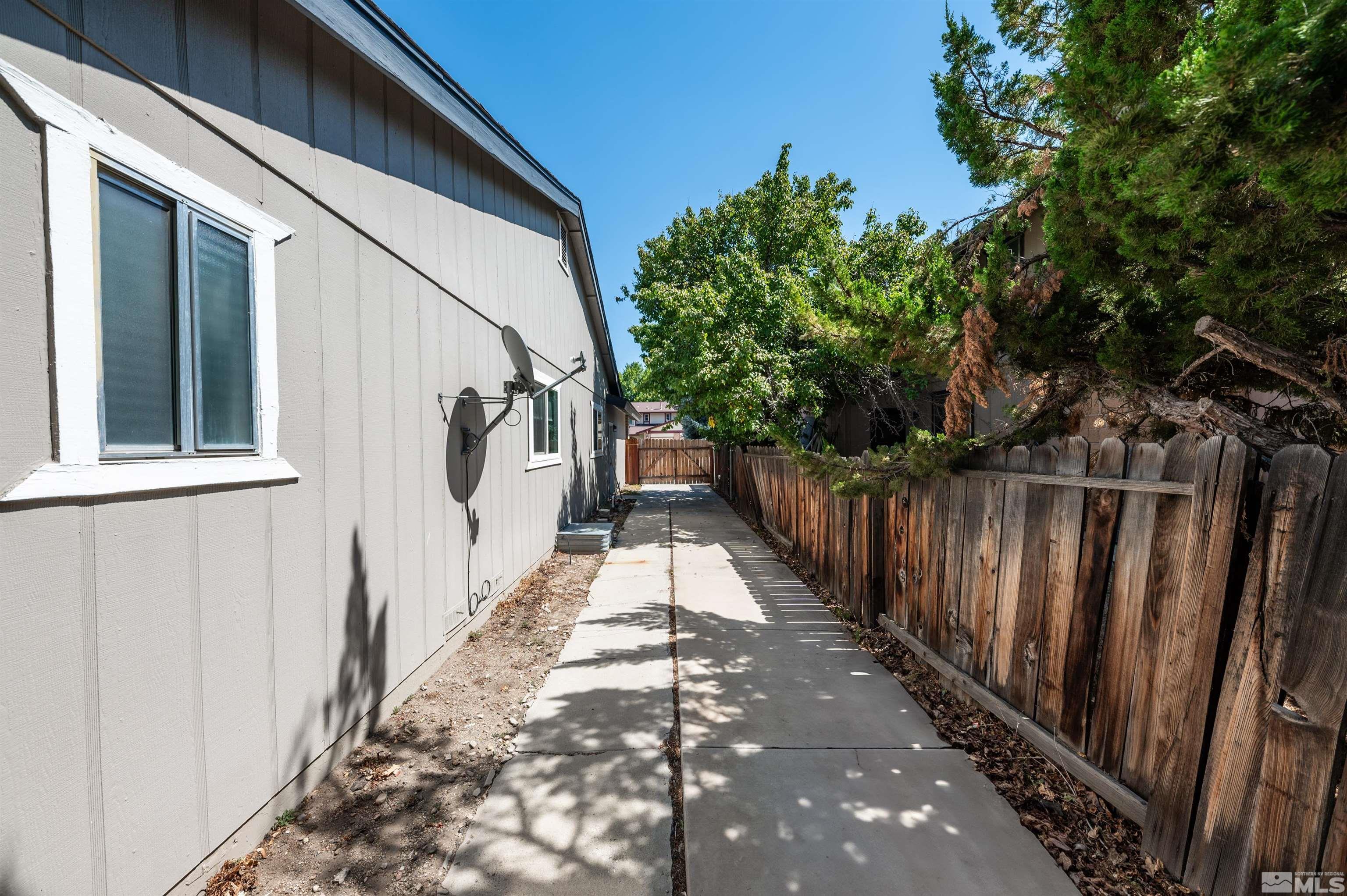 4795 Warren Way Reno, NV 89509 - Photo 37 of 40 a view of balcony with wooden floor and fence