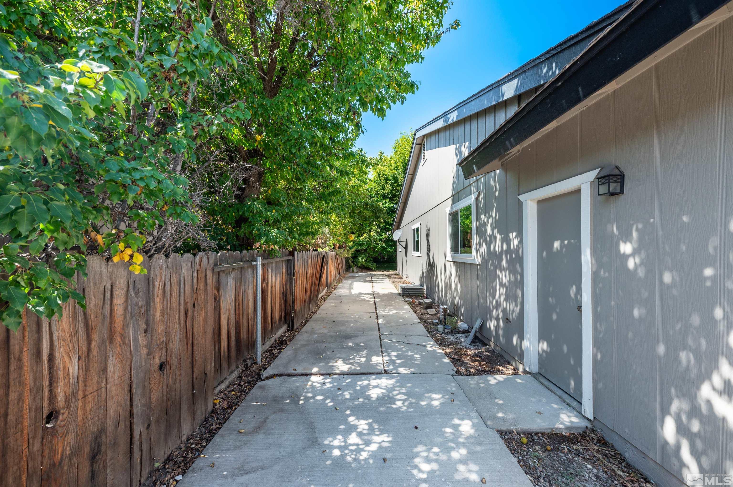 4795 Warren Way Reno, NV 89509 - Photo 38 of 40 a view of a pathway of a house with wooden floor