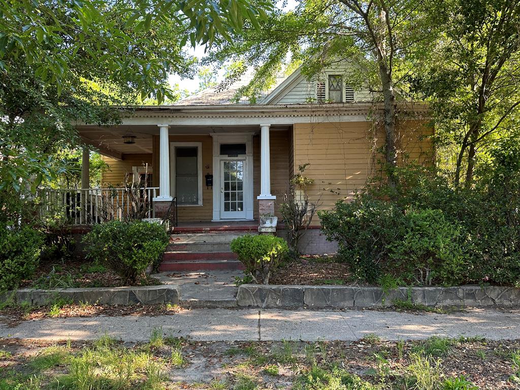 1329 19th Street, Unit B Columbus, GA 31901 - Photo 1 of 5 a front view of a house with garden