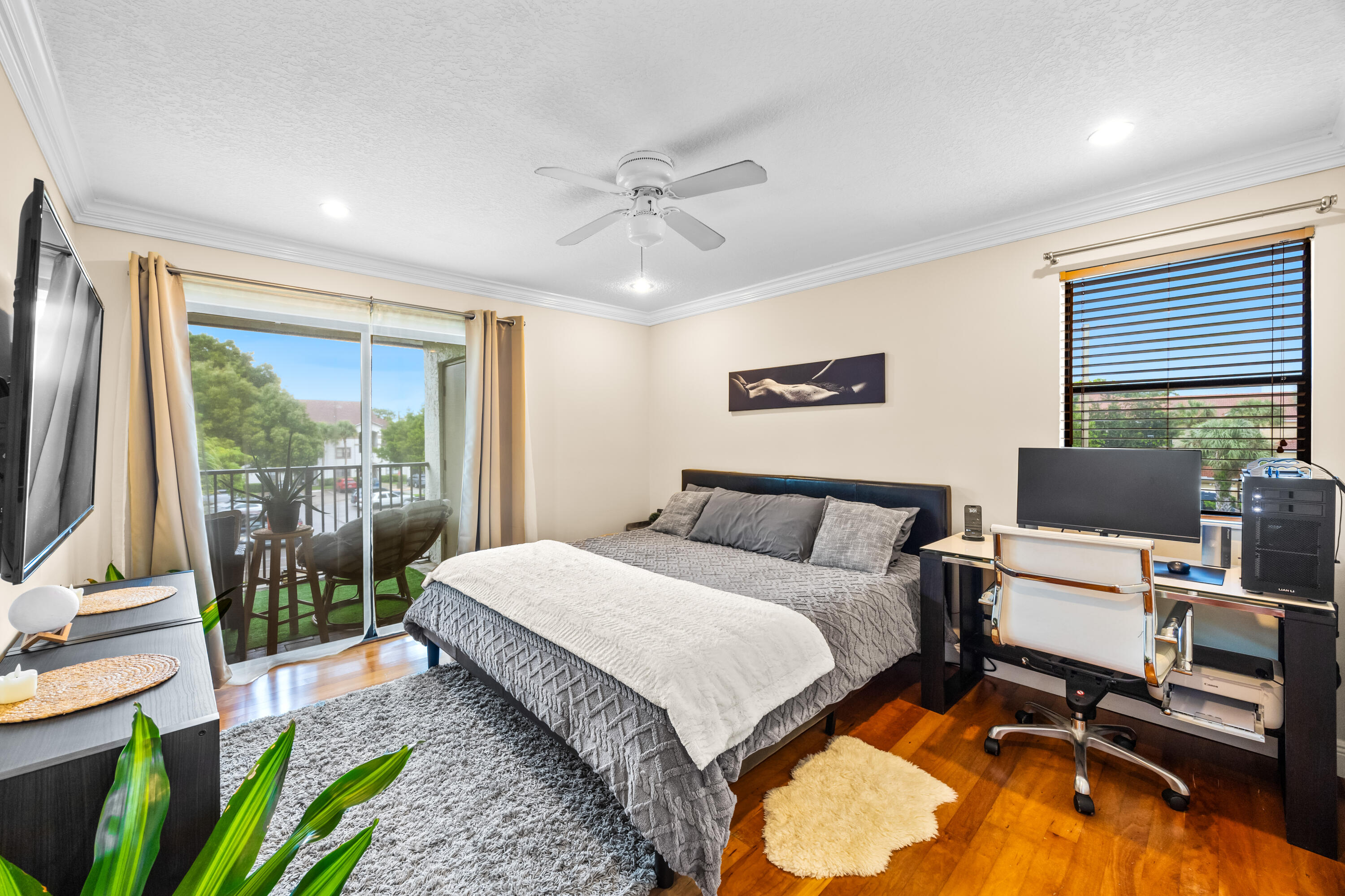 550 South Park Road, Unit 318 Hollywood, FL 33021 - Photo 11 of 27 a spacious bedroom with a bed and large windows