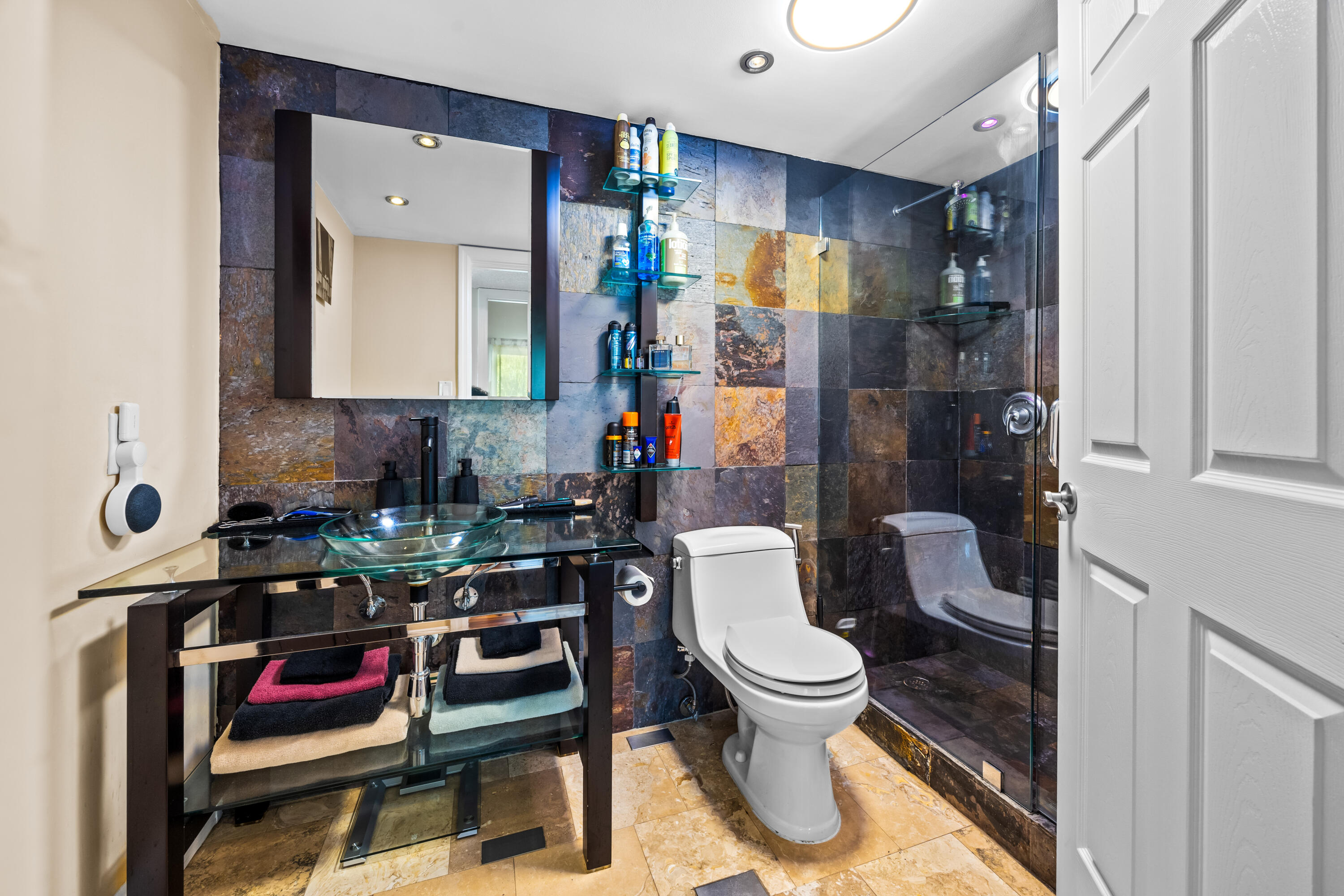 550 South Park Road, Unit 318 Hollywood, FL 33021 - Photo 13 of 27 a bathroom with a toilet sink vanity and shower