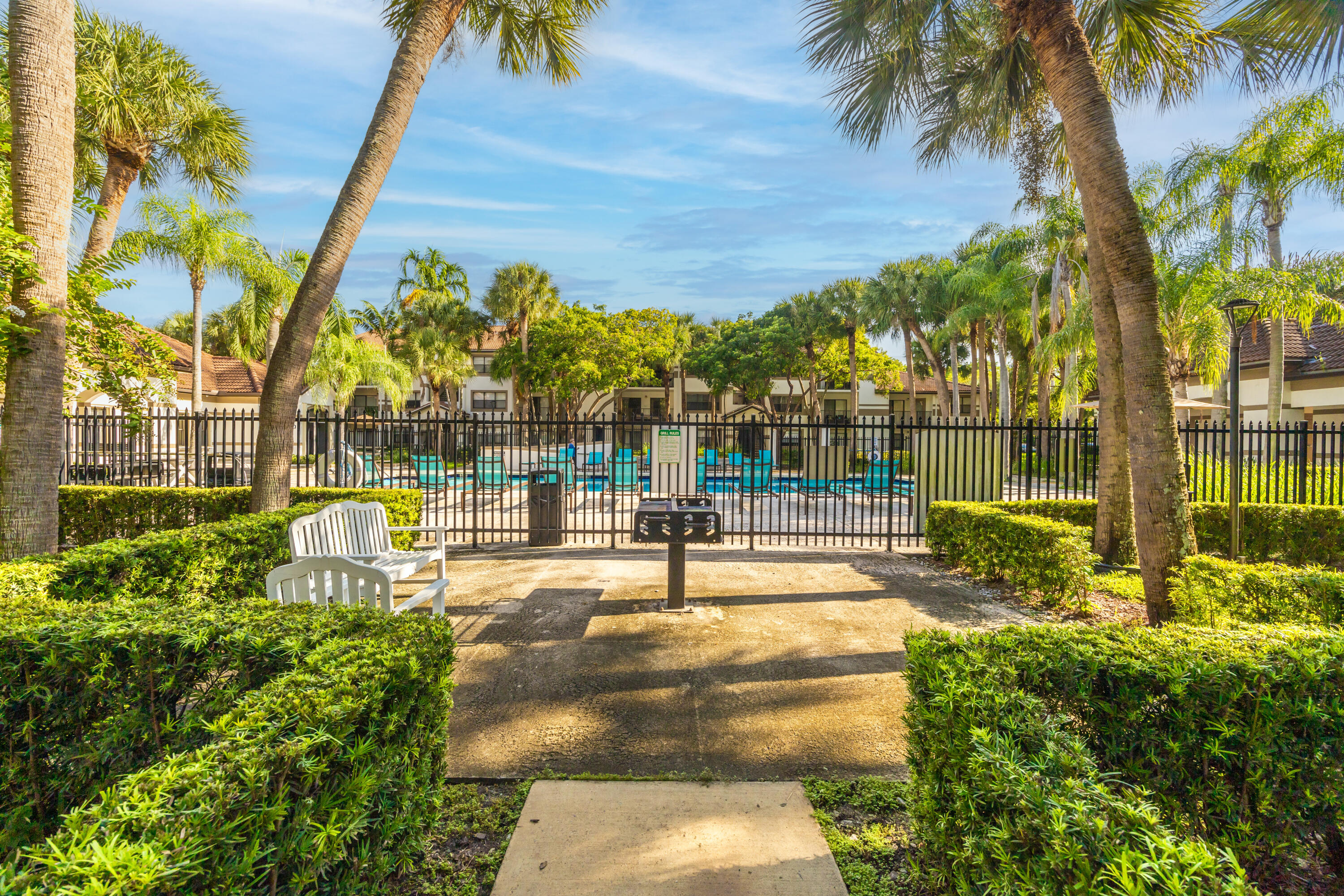 550 South Park Road, Unit 318 Hollywood, FL 33021 - Photo 23 of 27 a view of a park with couches and wooden fence