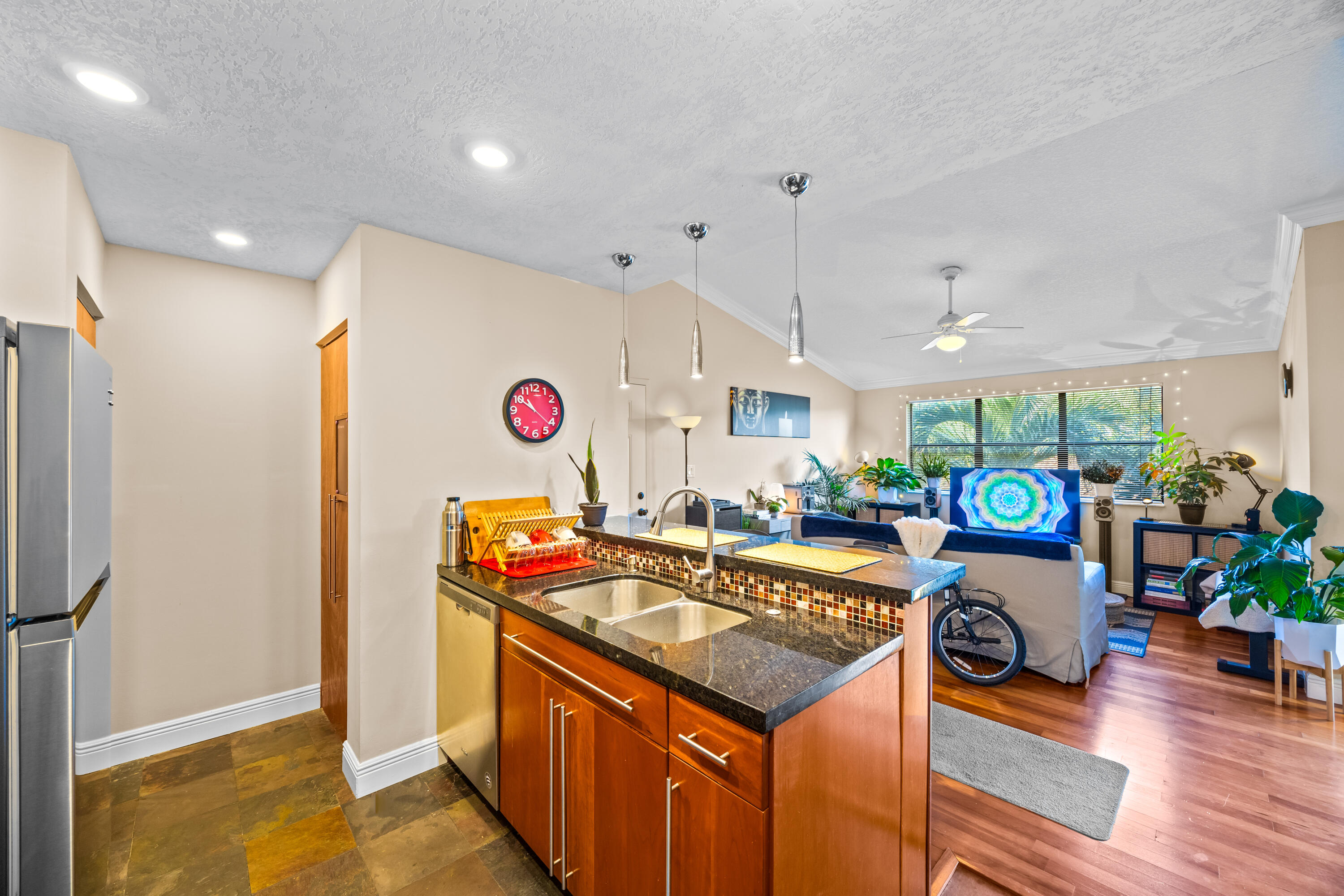 550 South Park Road, Unit 318 Hollywood, FL 33021 - Photo 5 of 27 a kitchen with stainless steel appliances granite countertop a stove and a refrigerator