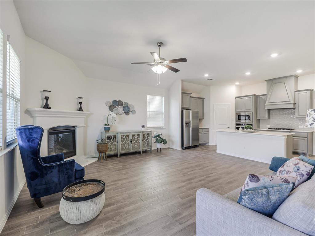 3024 Meredith Lane Forney, TX 75126 - Photo 5 of 29 Open-concept living space featuring wood-finish flooring throughout