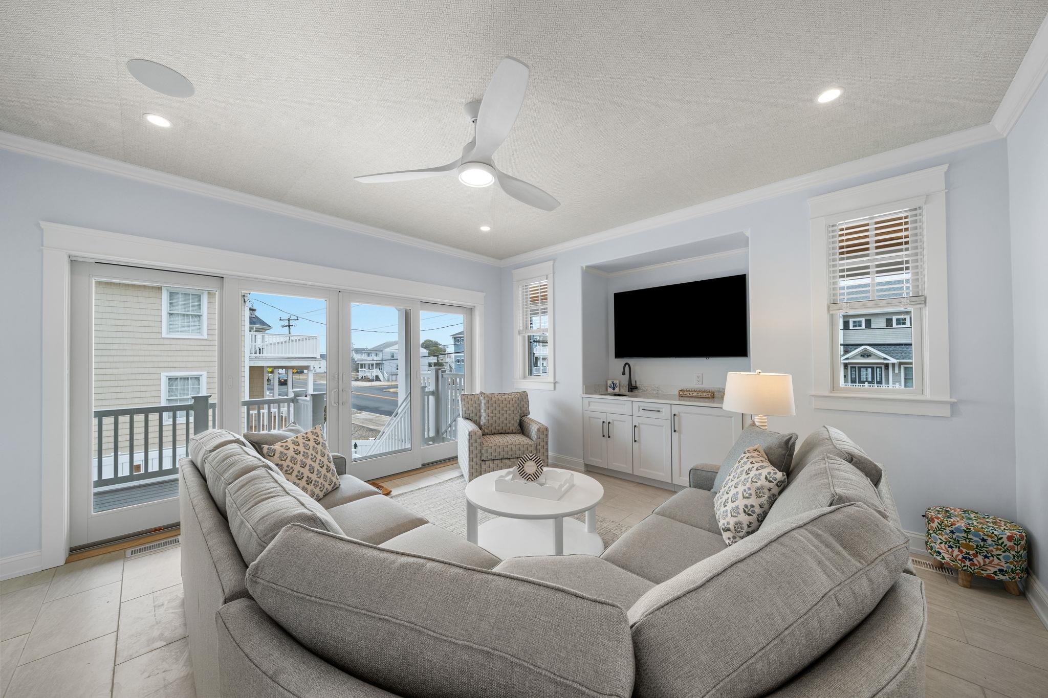 9102 3rd Stone Harbor, NJ 08247 - Photo 15 of 24 a living room with furniture fireplace and a flat screen tv