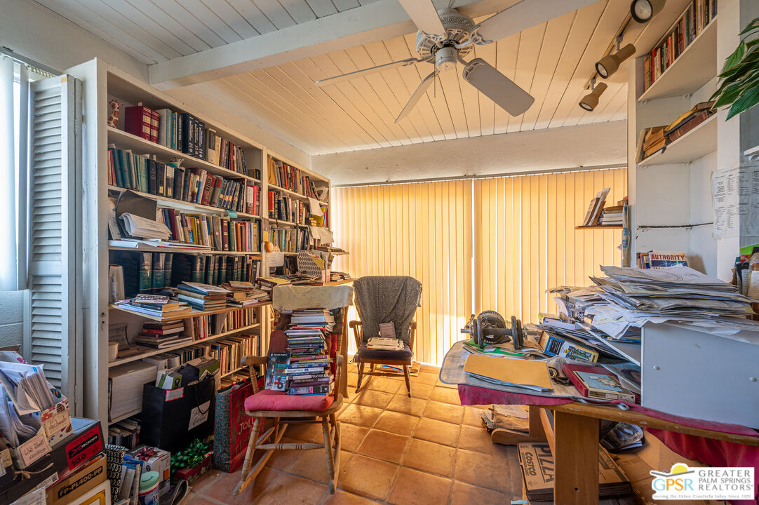 39910 Bird Lane Rancho Mirage, CA 92270 - Photo 15 of 45 a view of a workspace with furniture and a window