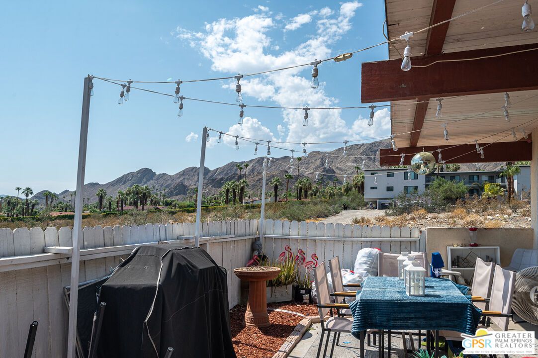 39910 Bird Lane Rancho Mirage, CA 92270 - Photo 16 of 45 a view of a chairs and table in patio