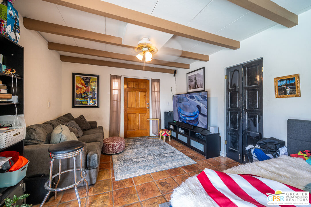 39910 Bird Lane Rancho Mirage, CA 92270 - Photo 19 of 45 a living room with furniture and a flat screen tv