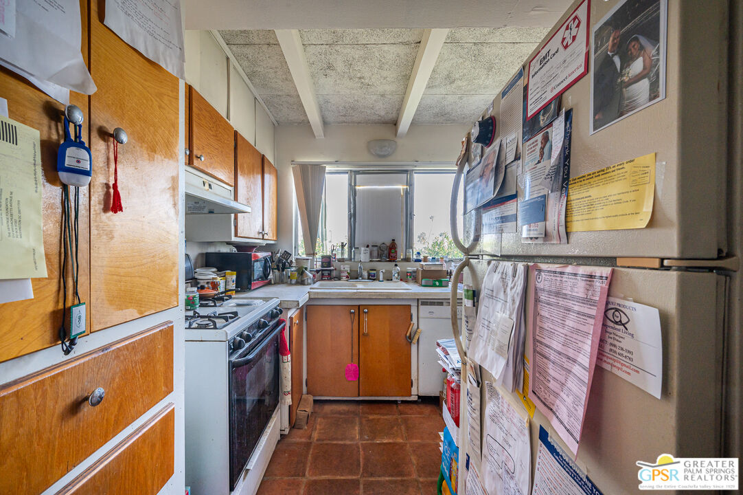 39910 Bird Lane Rancho Mirage, CA 92270 - Photo 28 of 45 a kitchen with stainless steel appliances granite countertop a refrigerator and a stove