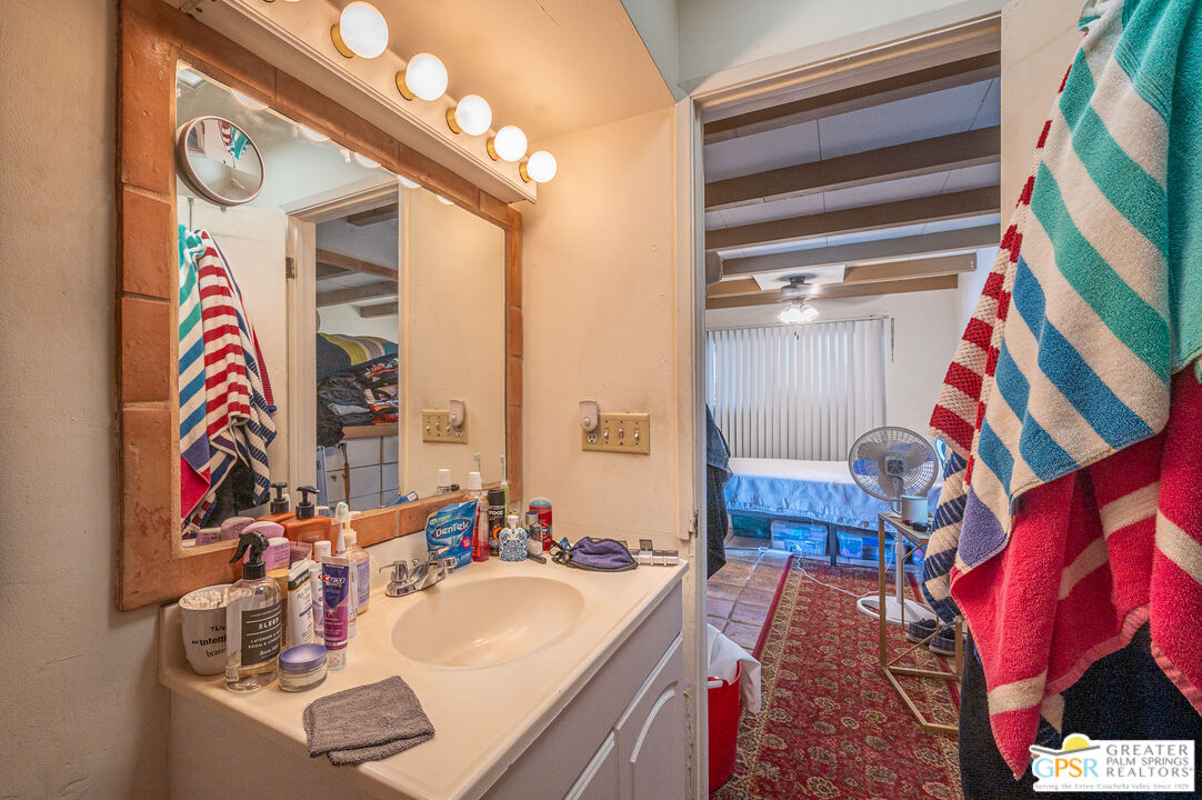 39910 Bird Lane Rancho Mirage, CA 92270 - Photo 31 of 45 a bathroom with a sink and a mirror