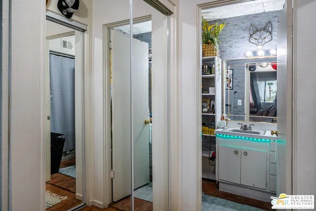 a room with cabinets and wooden door