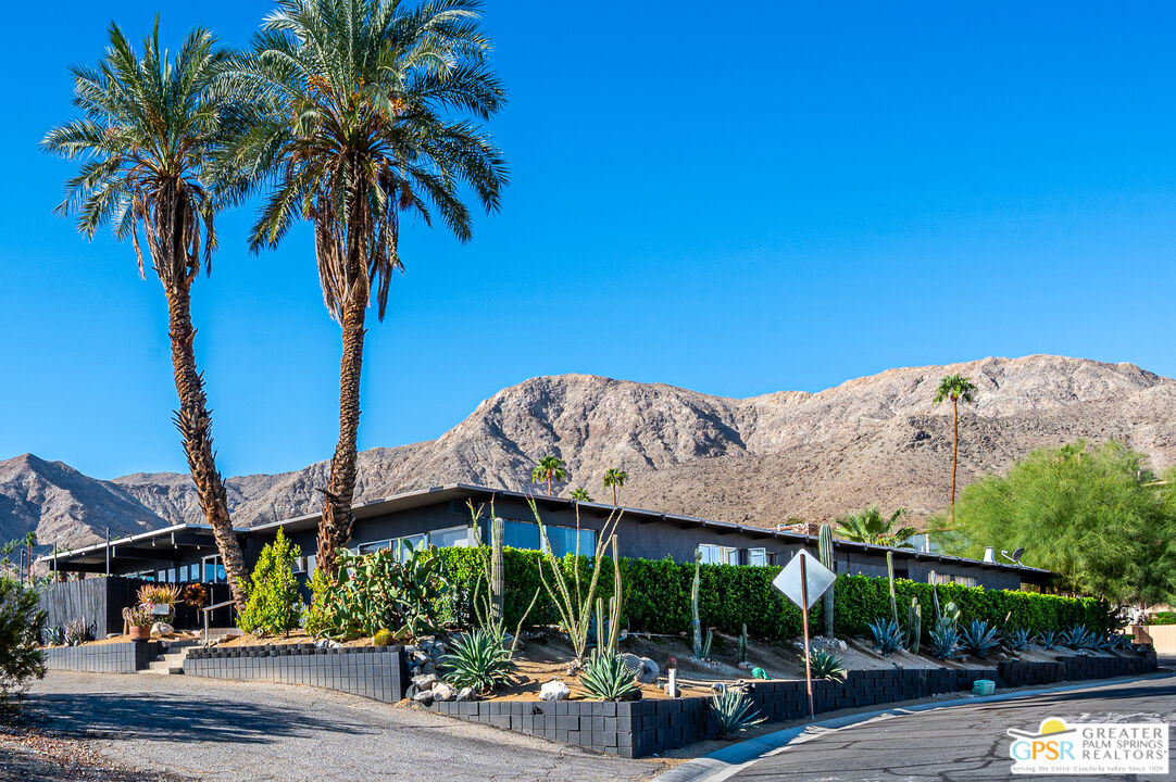 39910 Bird Lane Rancho Mirage, CA 92270 - Photo 36 of 45 a view of a house with a yard and potted plants
