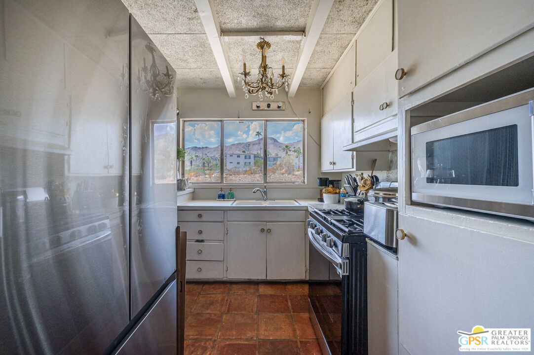 39910 Bird Lane Rancho Mirage, CA 92270 - Photo 4 of 45 a kitchen with cabinets and window