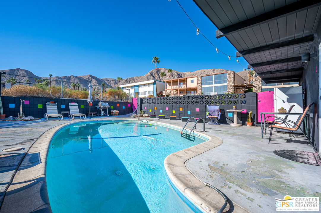 39910 Bird Lane Rancho Mirage, CA 92270 - Photo 42 of 45 a swimming pool with outdoor seating and yard