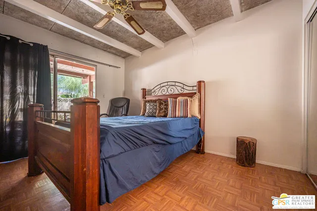 a bedroom with furniture and window