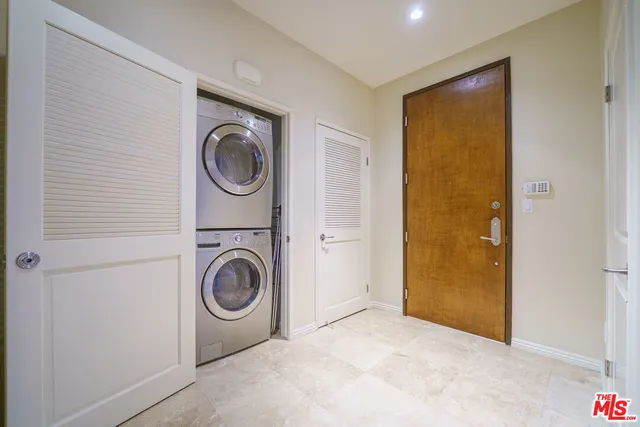 a view of a storage & utility room with washer and dryer