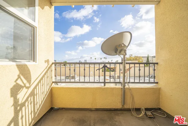 a view of a balcony with wooden floor
