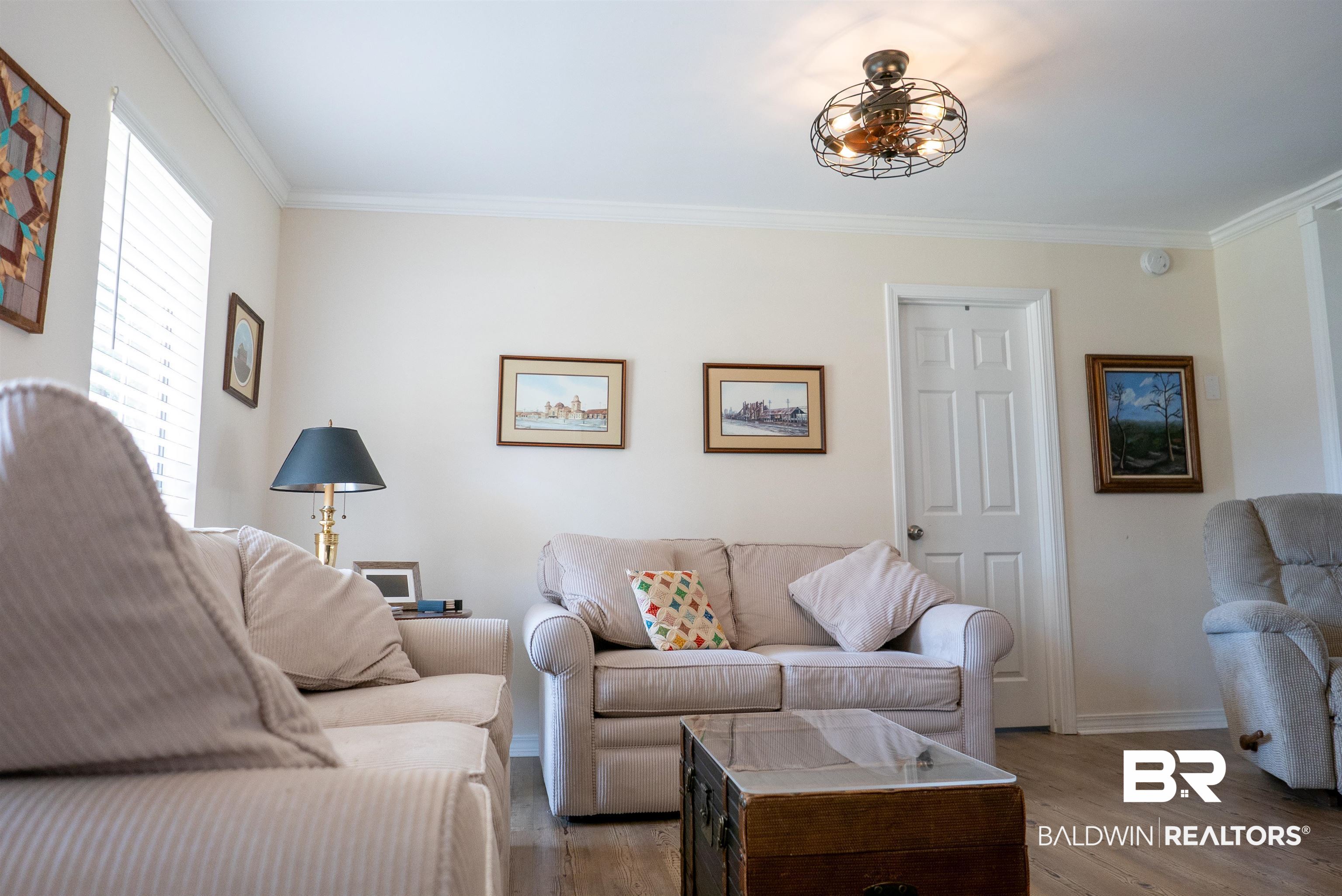 630 Spanish Main Daphne, AL 36527 - Photo 10 of 40 Living room featuring wood-type flooring and ornamental molding