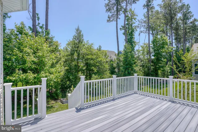 a kitchen with a sink refrigerator and cabinets
