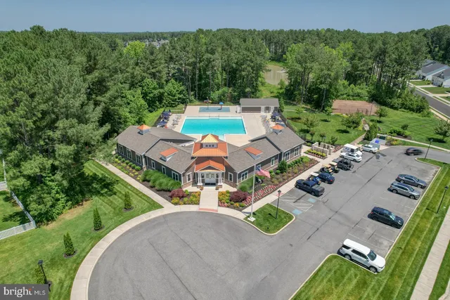an aerial view of a house with outdoor space swimming pool and mountains