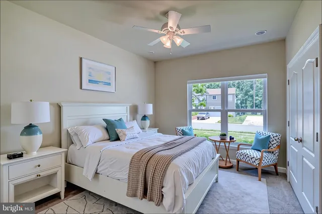 a bathroom with a granite countertop sink toilet a large mirror a shower and vanity