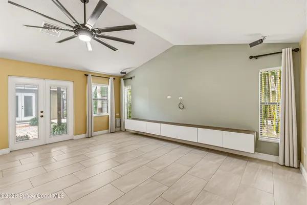 a view of an empty room with a window