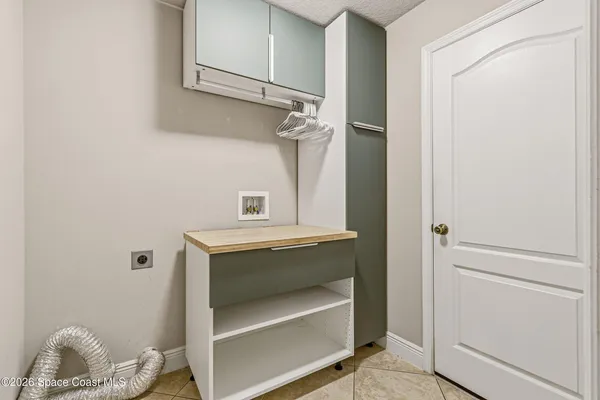 a view of storage and utility room with racks on the wall