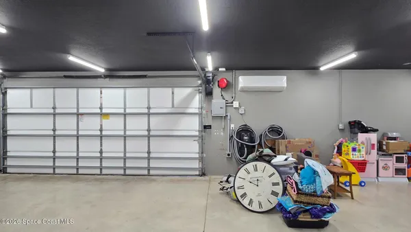 a bedroom with furniture and a chandelier