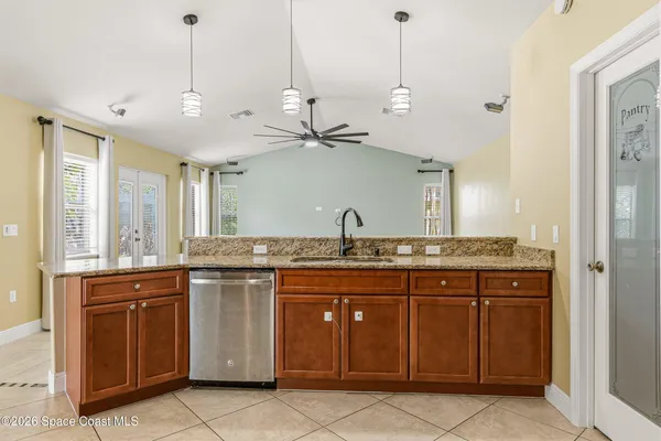 a kitchen with a sink and a stove