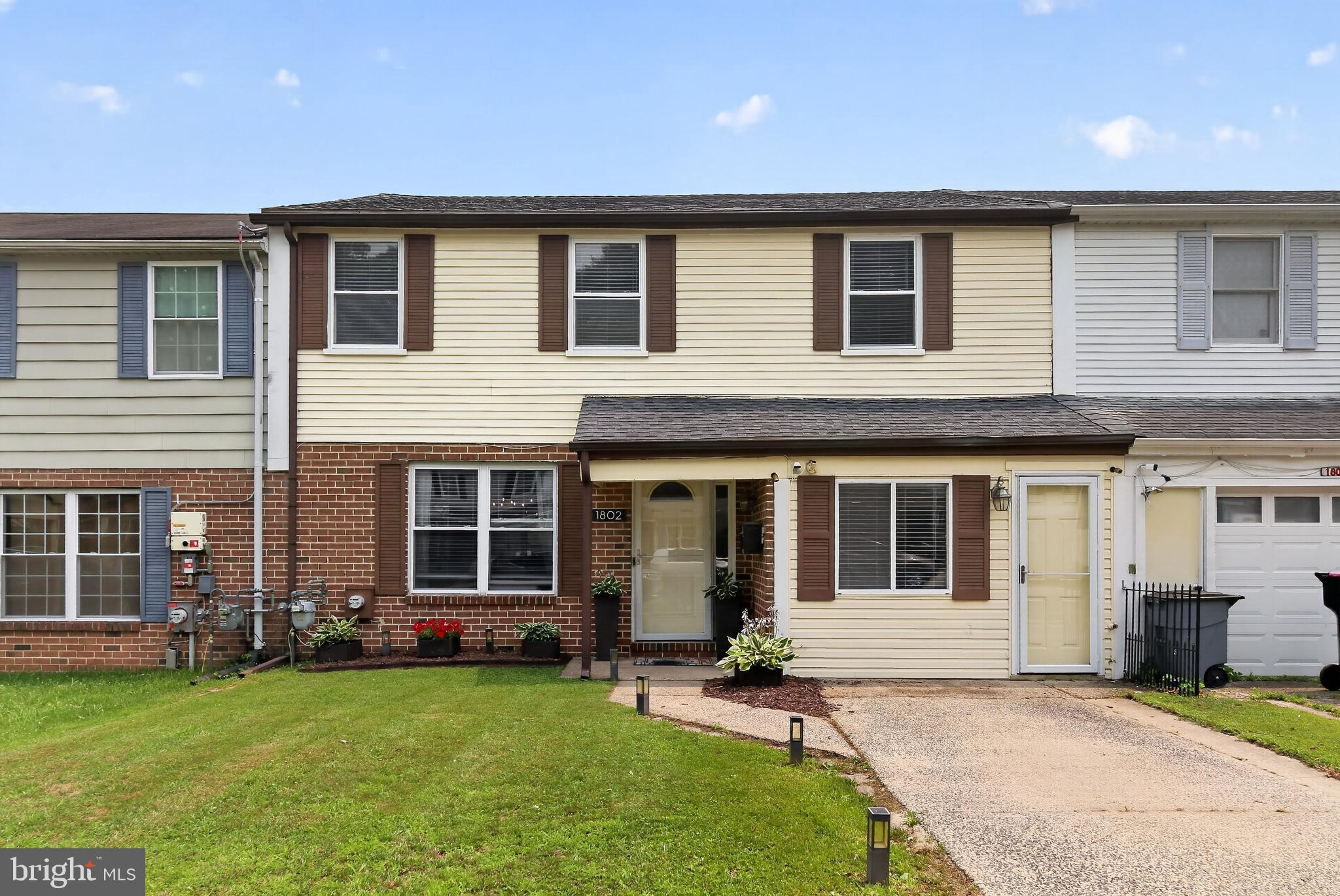 1802 Winding Way Clementon, NJ 08021 - Photo 2 of 30 a front view of a house with a garden and yard