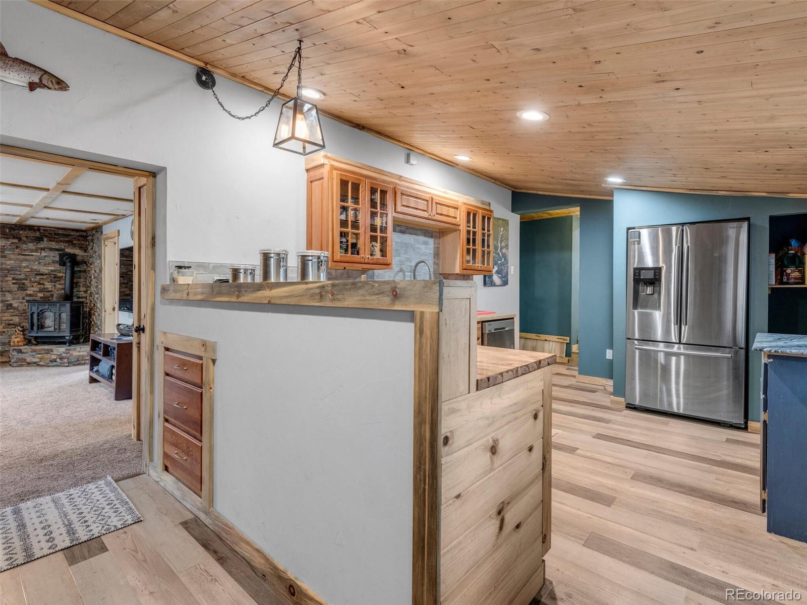 146 Dynamite Drive Black Hawk, CO 80422 - Photo 12 of 26 a kitchen with stainless steel appliances granite countertop a refrigerator a stove and a sink with cabinets
