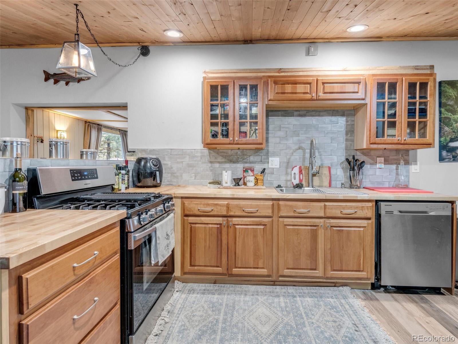 146 Dynamite Drive Black Hawk, CO 80422 - Photo 15 of 26 a kitchen with stainless steel appliances granite countertop a stove and cabinets