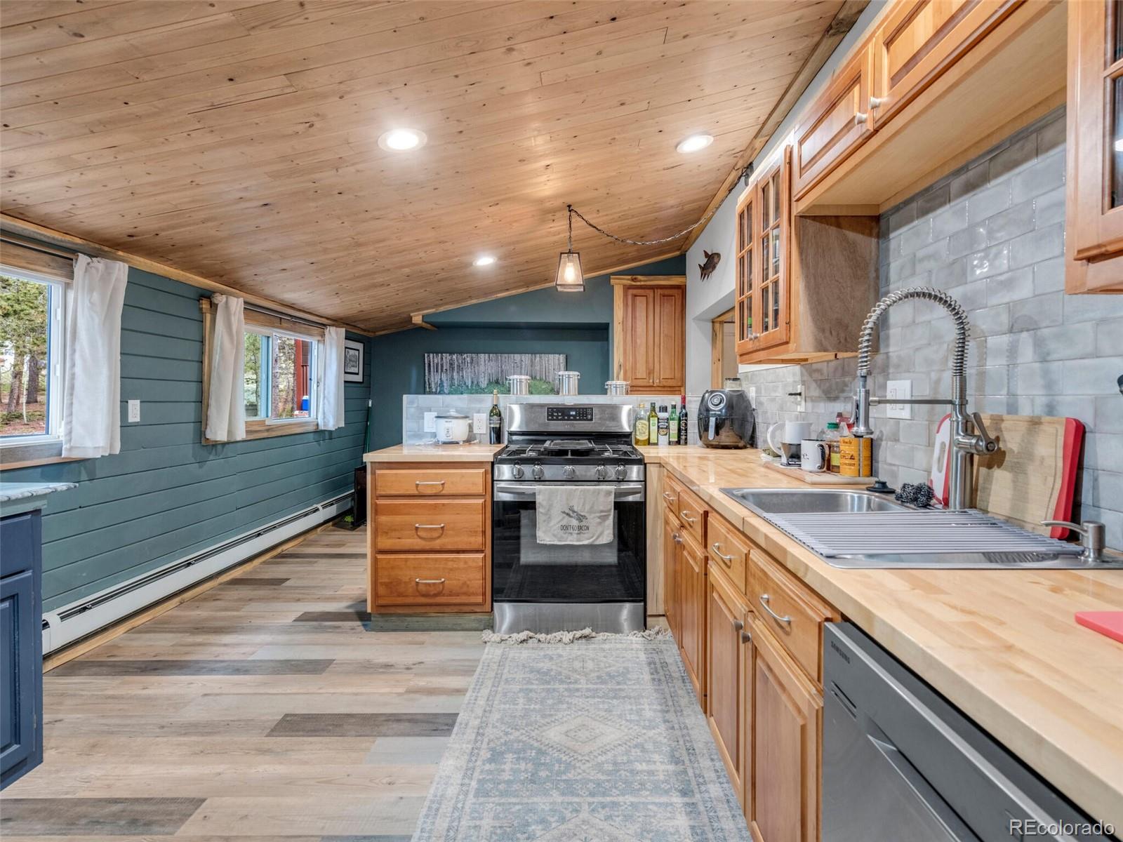 146 Dynamite Drive Black Hawk, CO 80422 - Photo 16 of 26 a kitchen with granite countertop a sink and stainless steel appliances