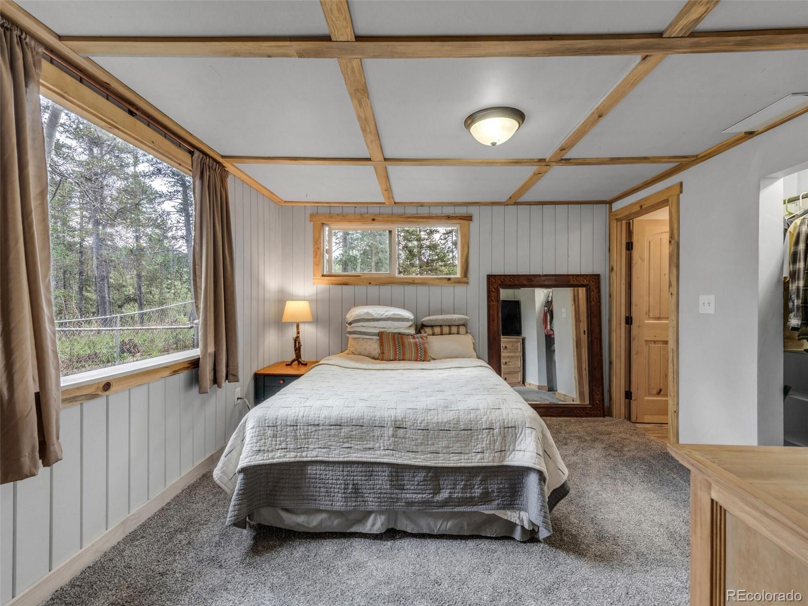 146 Dynamite Drive Black Hawk, CO 80422 - Photo 17 of 26 a bedroom with a bed and window