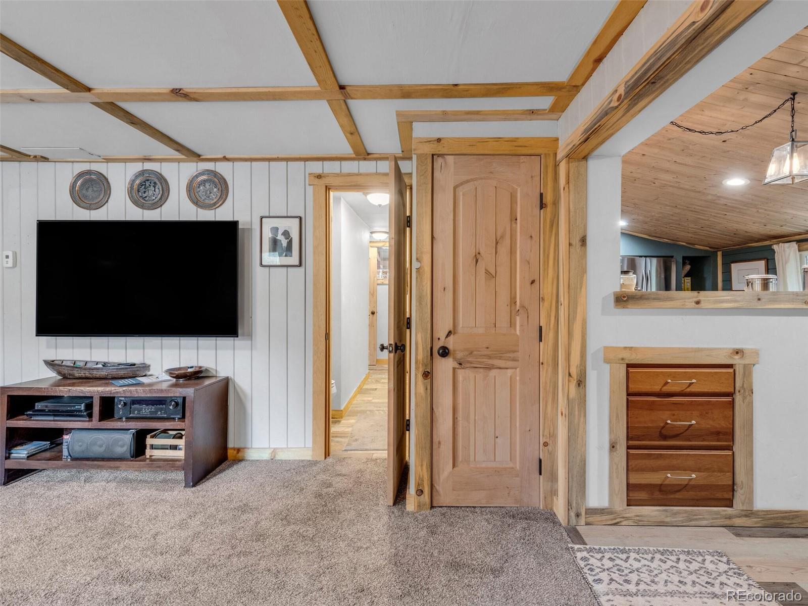 146 Dynamite Drive Black Hawk, CO 80422 - Photo 6 of 26 a living room with furniture and a flat screen tv