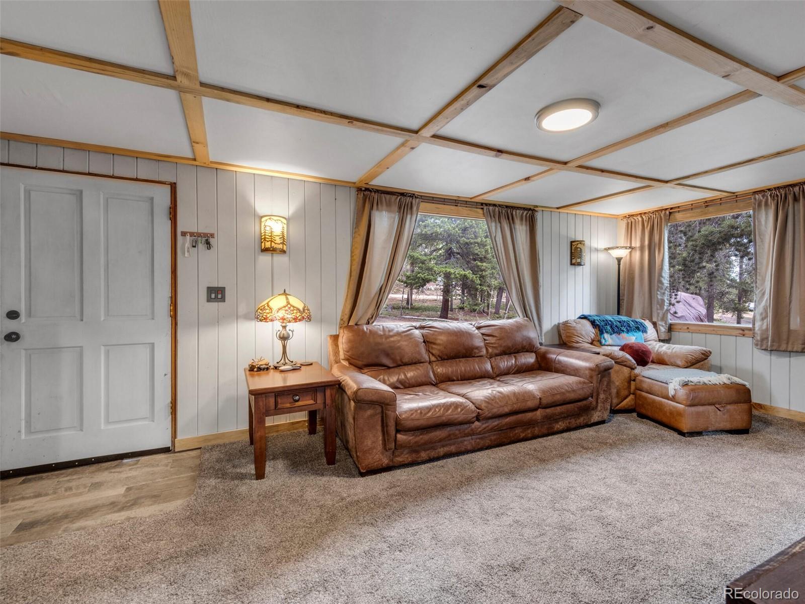146 Dynamite Drive Black Hawk, CO 80422 - Photo 8 of 26 a living room with furniture and a large window