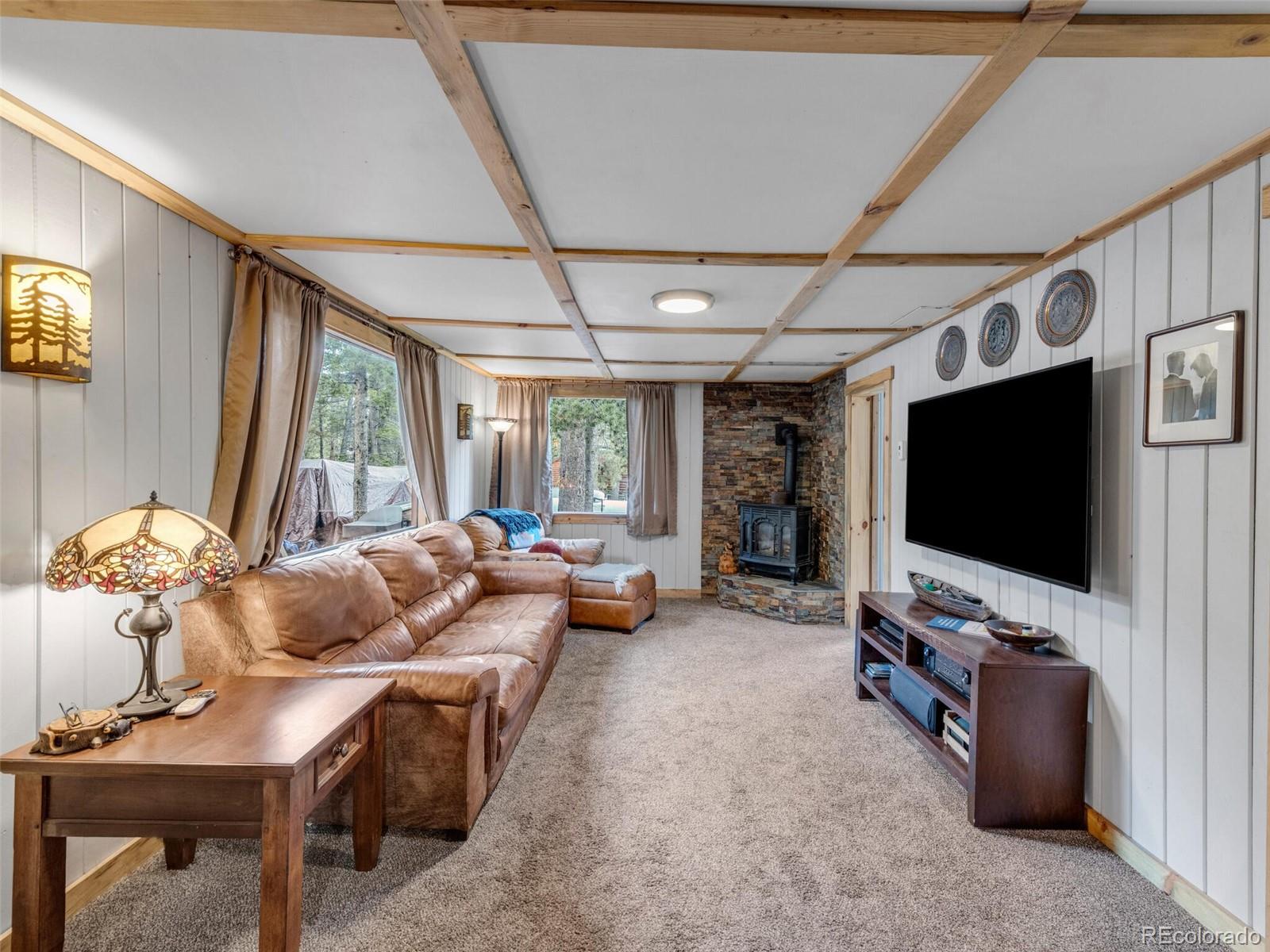 146 Dynamite Drive Black Hawk, CO 80422 - Photo 9 of 26 a living room with furniture and a flat screen tv