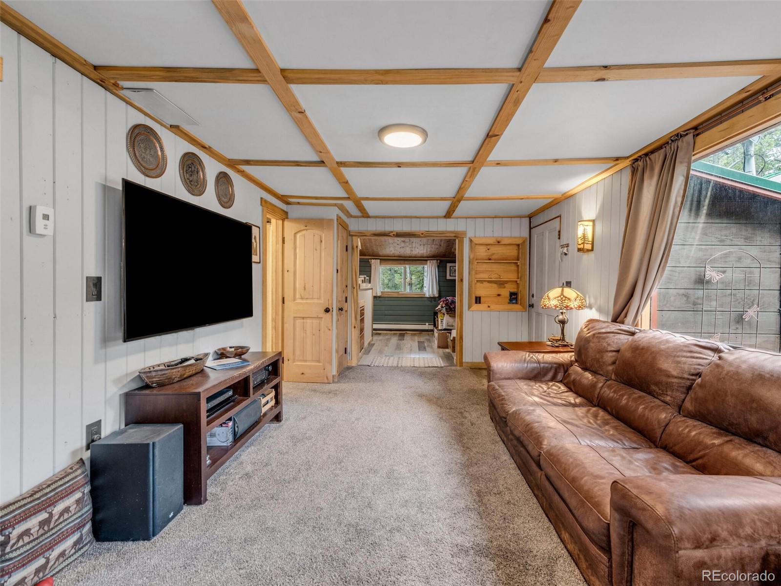 146 Dynamite Drive Black Hawk, CO 80422 - Photo 10 of 26 a living room with furniture and a flat screen tv