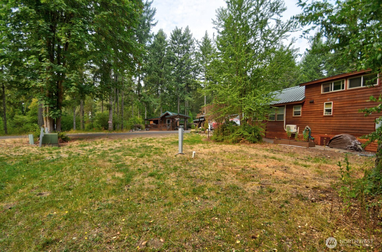 1546 Reservation Road Southeast, Unit 136 Olympia, WA 98513 - Photo 5 of 18 a backyard of a house with trampoline