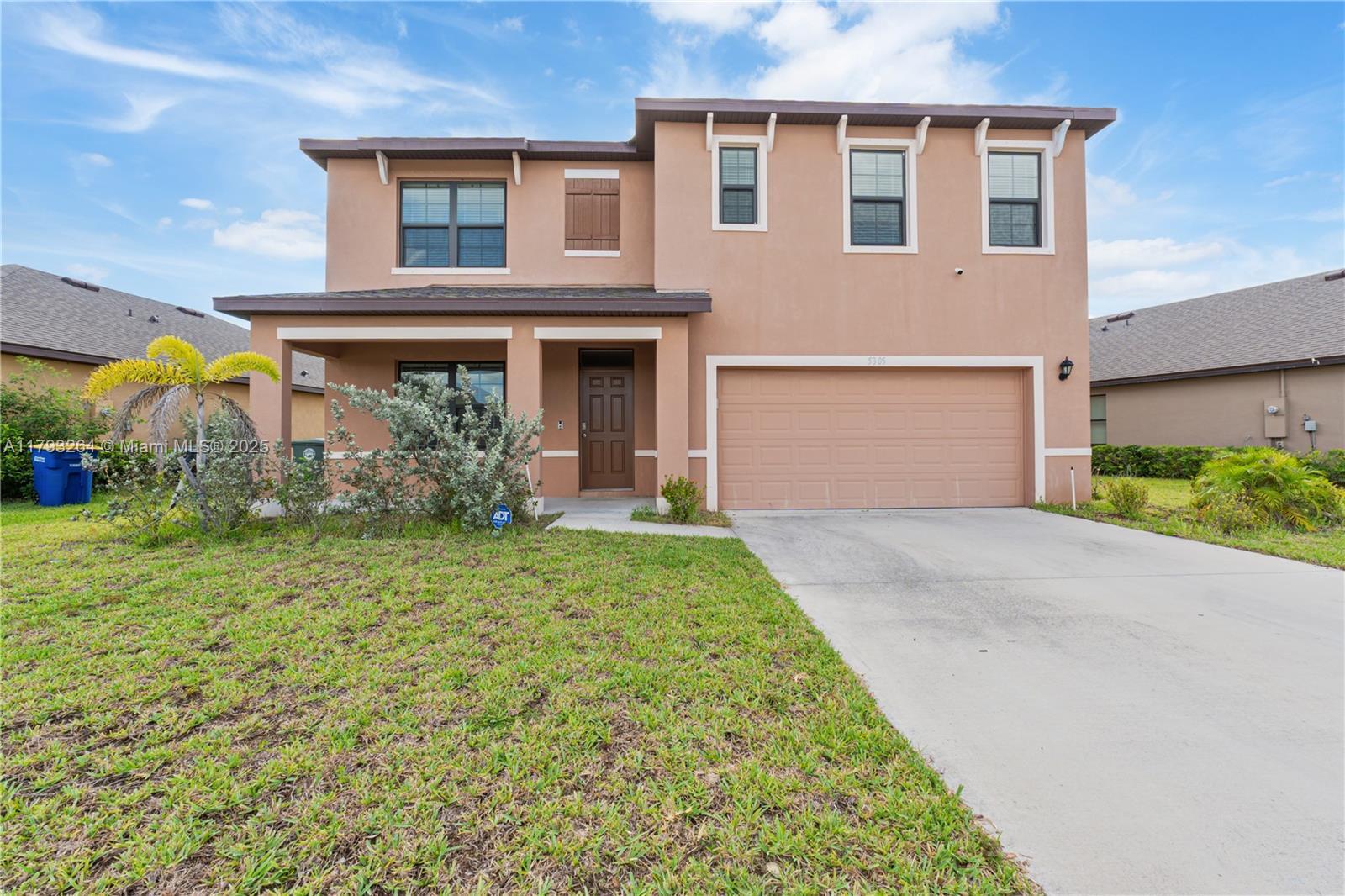 5305 Fantasy Drive Fort Pierce, FL 34947 - Photo 14 of 14 a front view of house with yard