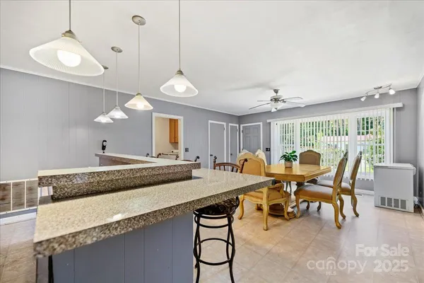 a view of a dining room with furniture window and outside view