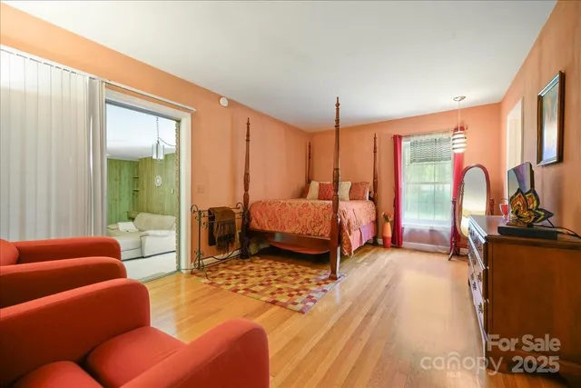 a bedroom with furniture and a window