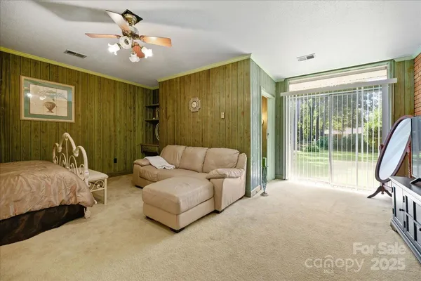 a living room with furniture a dining table and chairs