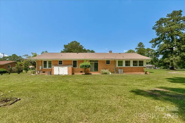 a view of a house with a big yard