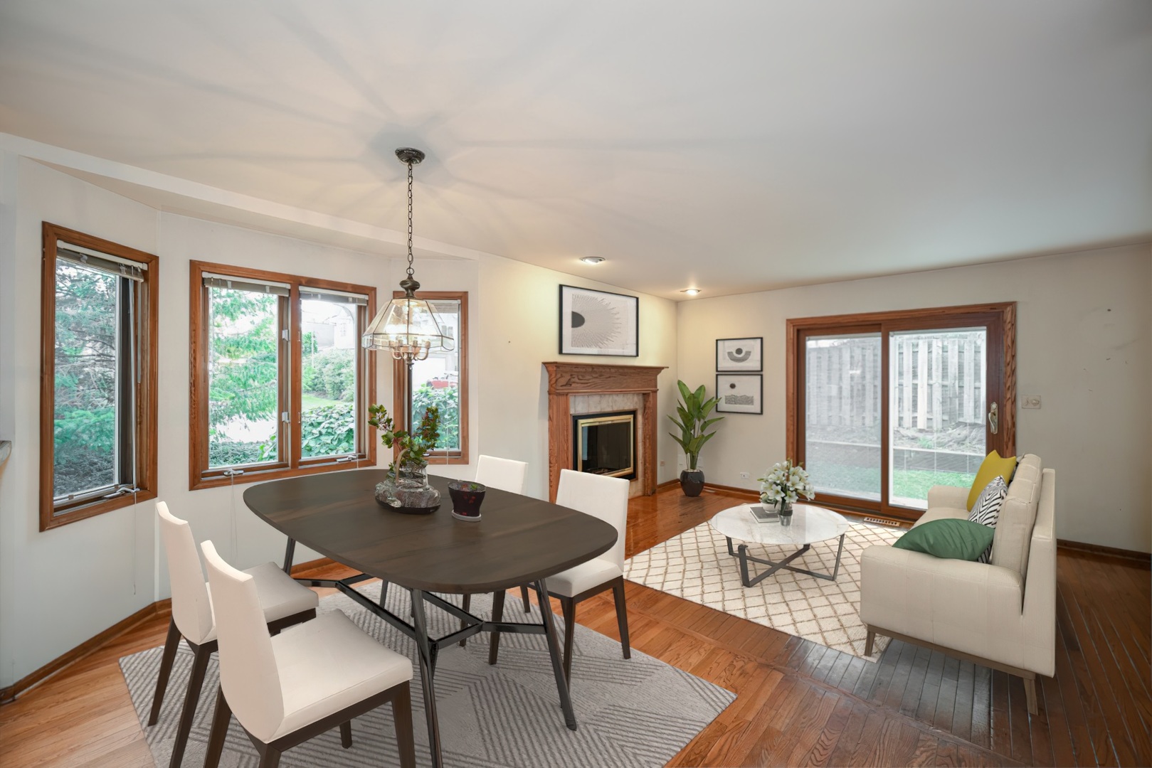 520 Renn Court Wheaton, IL 60187 - Photo 12 of 33 a living room with furniture a table and a fireplace