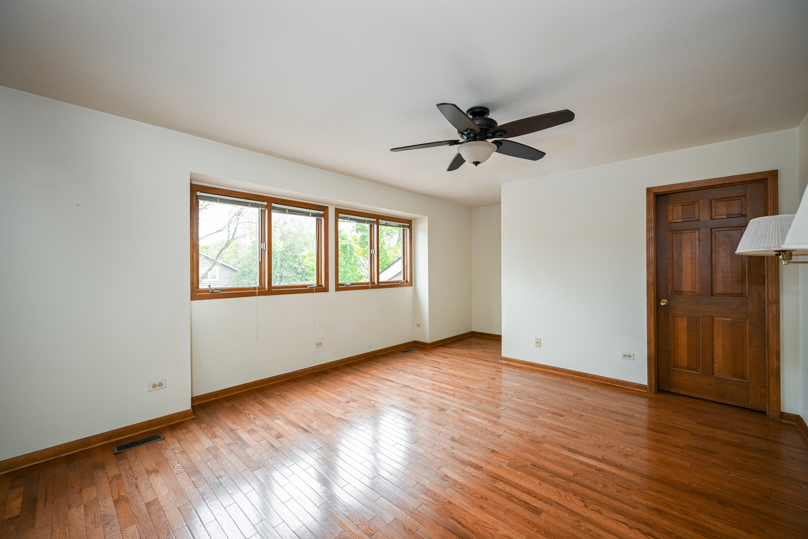 520 Renn Court Wheaton, IL 60187 - Photo 24 of 33 wooden floor in an empty room with a window