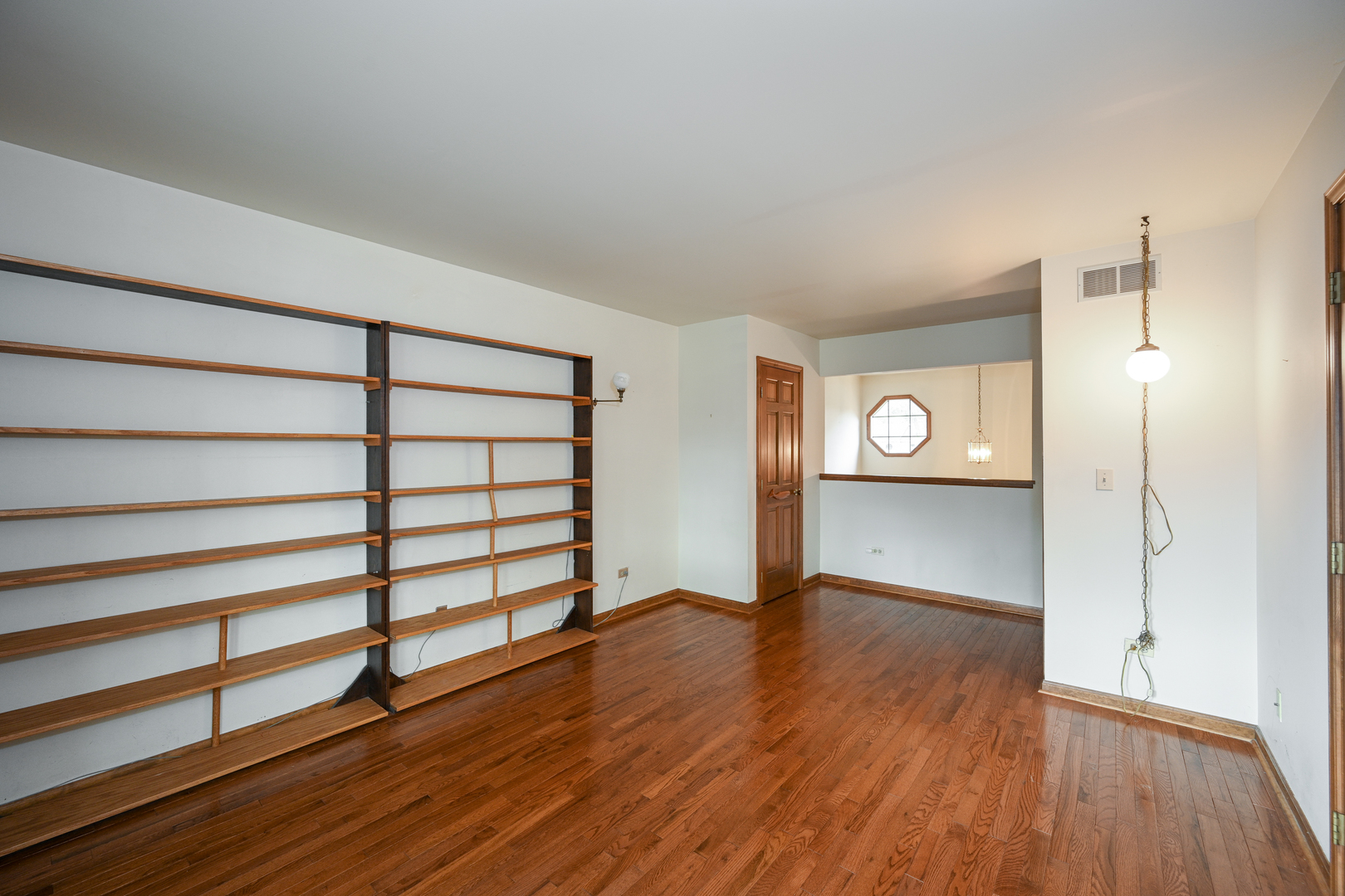 520 Renn Court Wheaton, IL 60187 - Photo 28 of 33 a view of empty room with wooden floor