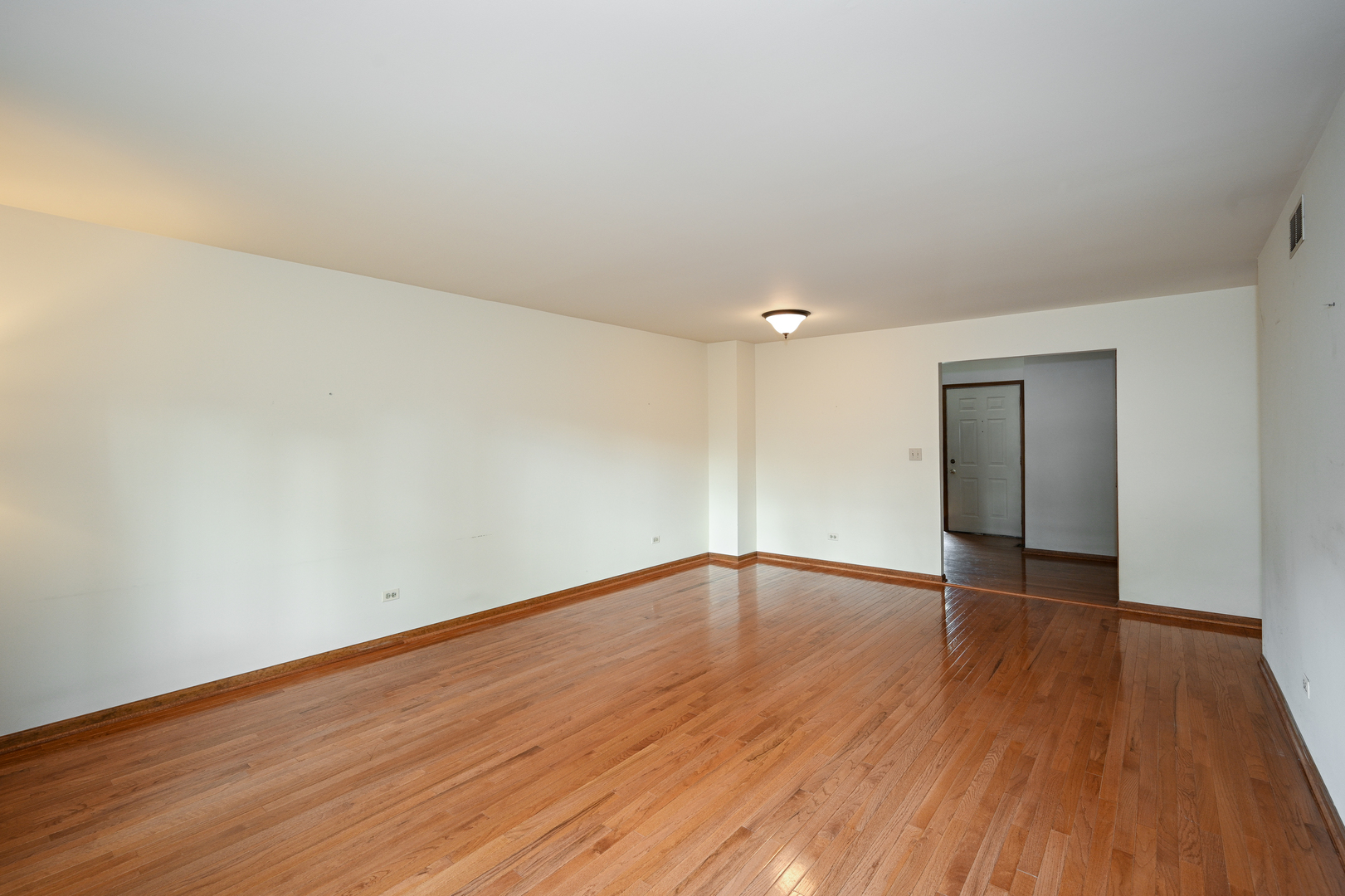 520 Renn Court Wheaton, IL 60187 - Photo 6 of 33 a view of an empty room with wooden and a window